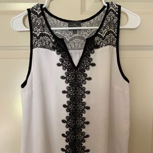 Black and cream sleeveless shirt